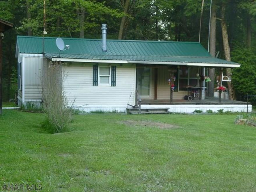 Extra room both inside and out.  Well kept park model with addition situated on an oversized campsite.  Plenty of room for all inside with two bedrooms and sleeping room in the living room also.  Outside you can access the property from Brookside Circle or Dutch Run Oval.  There is lots of room for all of your outdoor activities with room for parking your vehicles or boat.  Located in Glendale Yearound, a gated community with swimming pool, tennis/basketball/volleyball courts, club house, playgrounds, dog park, horseshoes.  Adjacent to Prince Gallitzin State Park / Glendale Lake.  Six miles from Rock Run ATV Park.