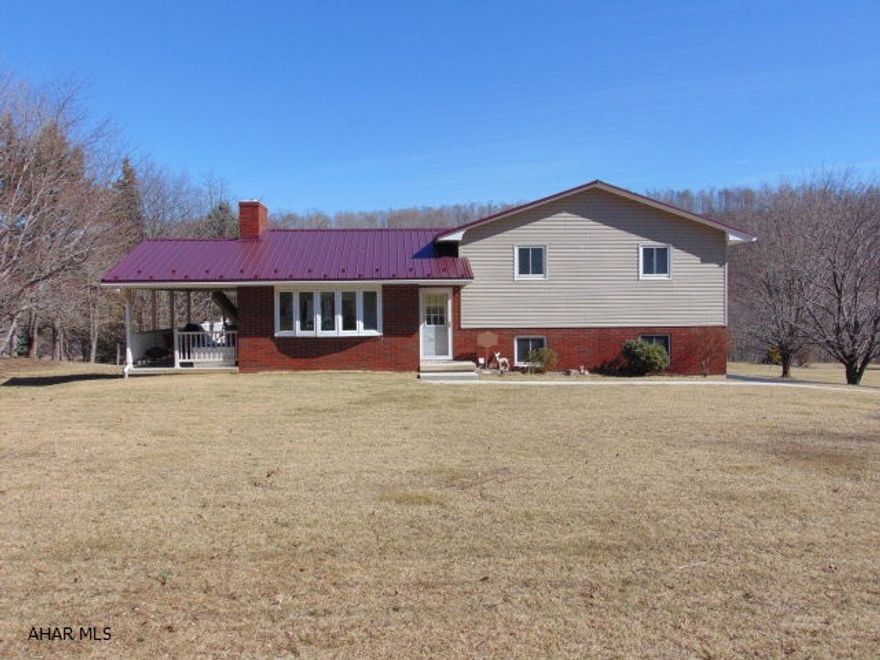 Move right in to this split-level home on an acre of rolling lawn.  Meticulously kept inside and out!  3 bedrooms, 1.5 bath, finished basement, central air, oil heat with 3 back-up heat sources.  Maintenance free decking, newly sealed black top driveway, new roof and a vinyl/brick exterior.  All appliances included!