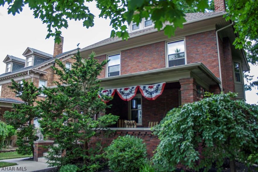 Here is a rare chance to own a beautifully updated classic four-square brick home within walking distance of historic Hollidaysburg downtown, post office, YMCA, market, court house and eating establishments downtown.  Many of the original details were kept intact during renovation projects.  5 bedrooms and 2.5 baths with a bonus heated enclosed sun room, gorgeous living room with fireplace and window seat lead into the formal dining room through pocket doors.  And wait until you see the kitchen with SS appliances and large granite island.  Double split staircase takes you up to the 2nd floor.  This home is really designed for outdoor enjoyment too with the huge front porch, covered rear deck and step down open deck.  Lovely rear yard.  Really a one-of-a kind home.