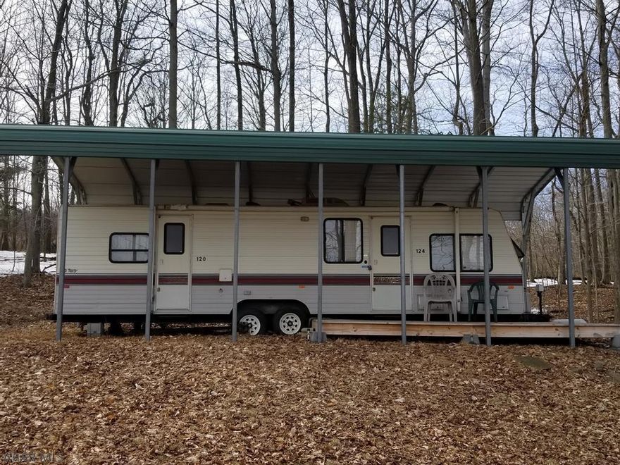Camper with pavilion on one lot inside Glendale Yearound. PRICED TO SELL! Ready to use today. Glendale Yearound is a gated community minutes from Glendale Lake and Prince Gallitzin State Park.