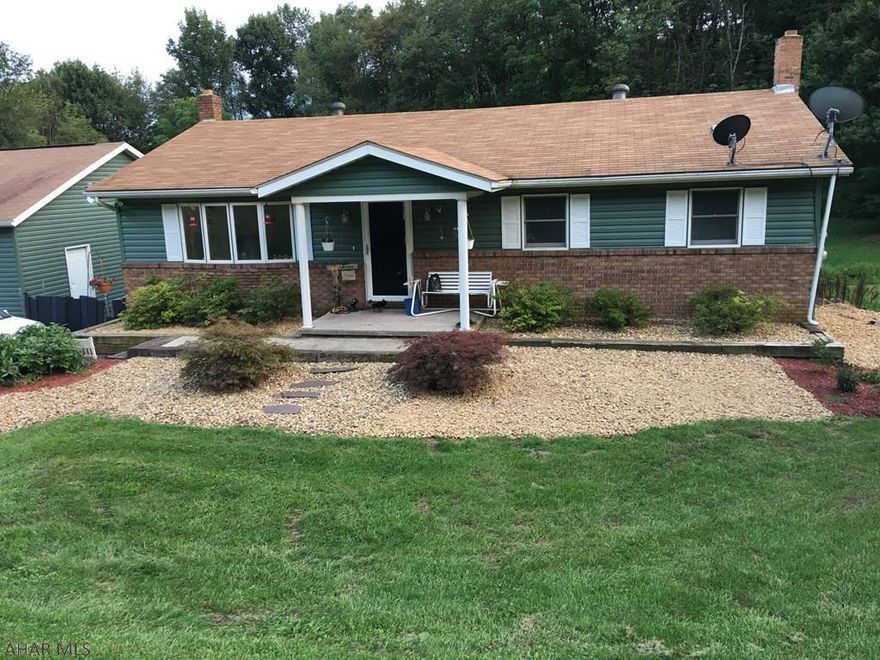 Nicely kept 3 bedroom ranch on just over one acre. Newly remodeled kitchen and living room. Back deck overlooking property. Detached 3 bay heated garage with a walkway to the house. Outdoor wood burner heats garage, house and water (in winter) natural spring feeds 1000 gallon holding tank/well. Beautiful county setting. Basement is walk-out partially finished. Could easily be converted into a rec room.