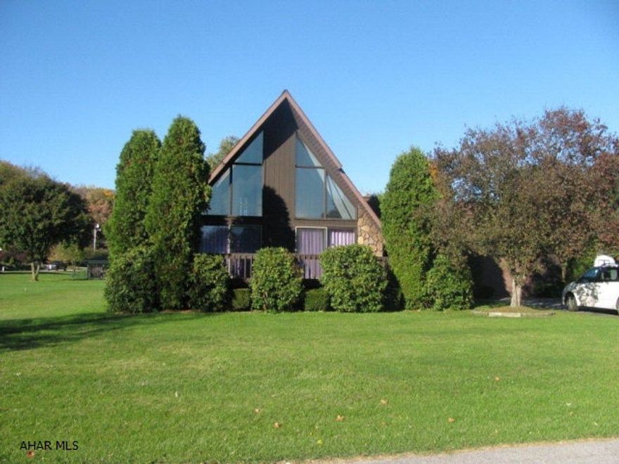 Contemporary Bellwood home on 1/2 acre quiet development near school. This home offers a spacious new kitchen w/ appliances & solid surface countertops! Great room w/ vaulted ceilings & gas fireplace! One story living possibilities w/2 bedrooms & 1 bath on the first floor! Spiral staircase leads to 2nd story bedroom and bath! All freshly painted! Full basement for storage or room to expand! Hot water furnace w/option for oil or coal! Sunroom and 2 decks for outdoor entertainment and enjoyment!