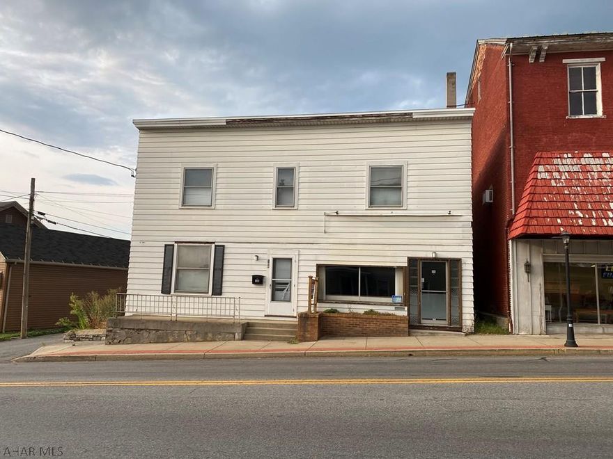 Value Add Opportunity. Currently a turn-key two unit commercial building. Side by side units, one has been used as a commercial space with a store front along Allegheny Street, excellent road exposure. The other side is a two story townhouse featuring four bedrooms and 1.5 bathrooms. The townhouse is very spacious with a living room, dining room and large eat in kitchen with laundry and half bathroom on the first floor, while the second floor features four bedrooms with large closets and a bathroom. Building has a private parking lot with 5 parking spaces that could fit a box truck or double parked cars. Opportunity to make this a three to four unit multi-family apartment building, that will only add to your gross rent.