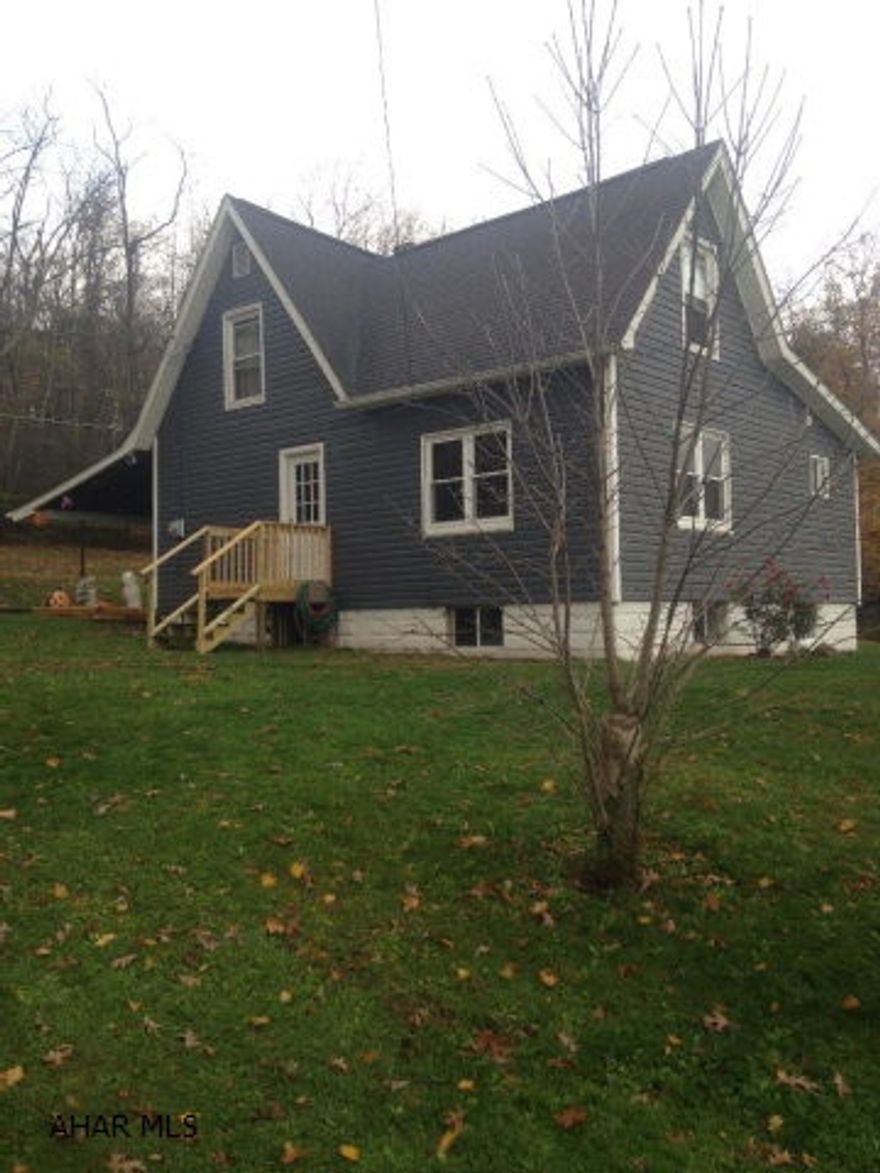 Quiet country setting has 2 bedrooms with new siding, situated on .8 acre. Los of updates could be captive 3 bedroom or office.