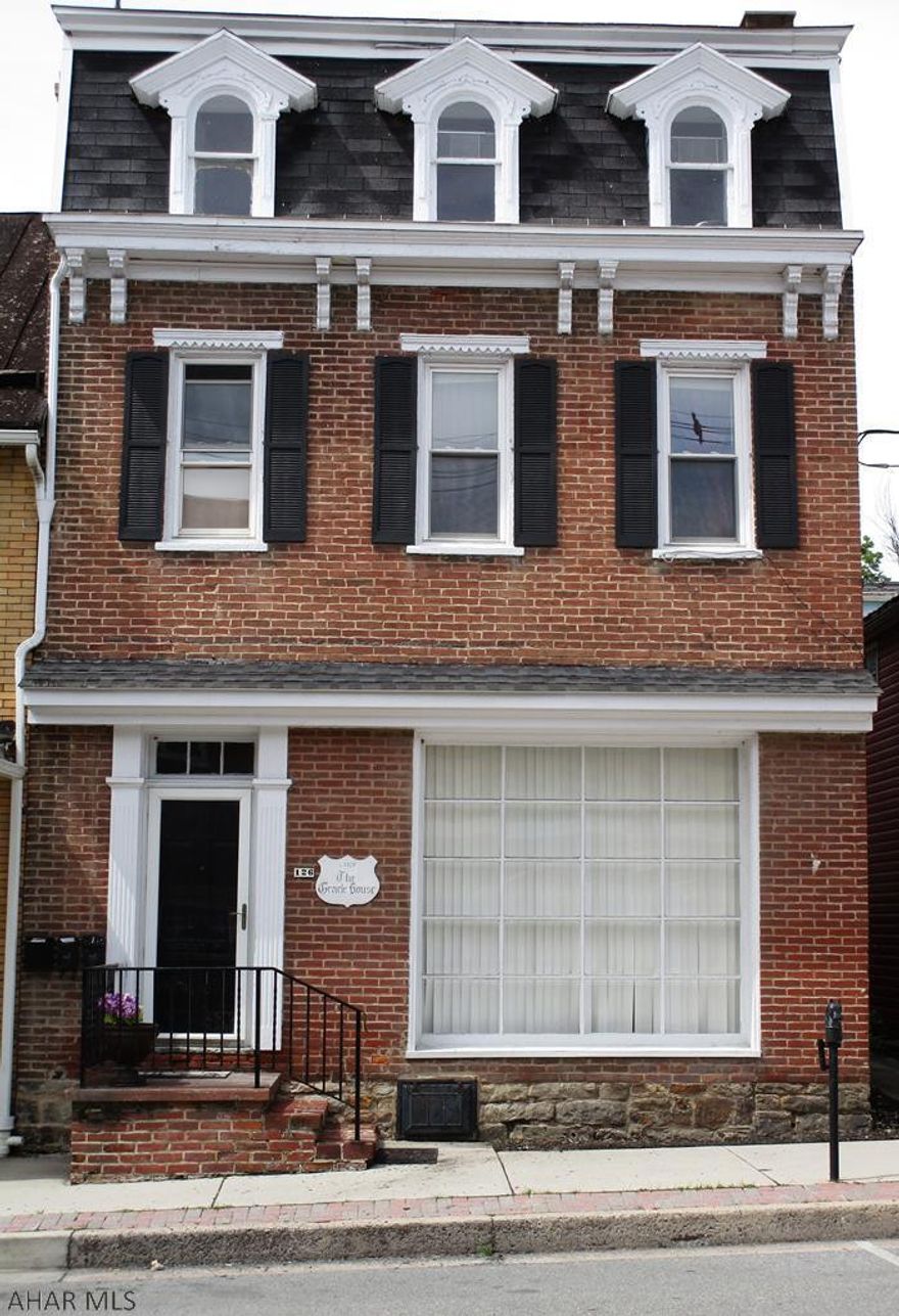 Looking for an apartment? Second floor, 2 bedroom apartment with a large living room, dining room and kitchen. Kitchen includes a refrigerator and stove. Private entrance. Covered porch.  Tenants are required to pay water and electric. Rent includes off street parking. On-site laundry as well. $800/month and security deposit $800 due when signing lease.