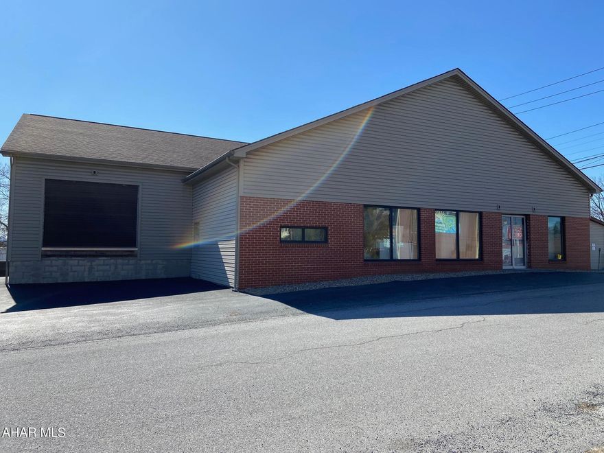 Multiple uses possible with this studded out open span building. The main level is approximately 4,568sf with two loading docks and over 3,400sf of potential warehouse space. The lower level has an overhead door and is over 2,700sf. There is 3 Phase 240volt electric service. The building went through an extensive overhaul in 2005-2006 with all new exterior walls, new engineered floor joists, all new roof trusses, new siding, soffit facia and windows, paved parking lot and block retaining wall. Conveniently located only one block off of Pleasant Valley Blvd.