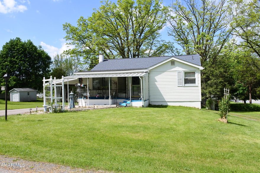 Lakemont home on a spacious half acre lot! Watch the fireworks from your yard and walk to Curve games! Easy living on 1 level, updated kitchen, large living room, dining room and 2 bedrooms on the main floor.  Downstairs you'll find a family room, a 2nd kitchen, 2nd bath and walk-out to a covered patio.  Possible living quarters for in-laws or adult children? Airbnb? Lots of storage. Good mechanics! Gorgeous yard for lazy Summer evenings.