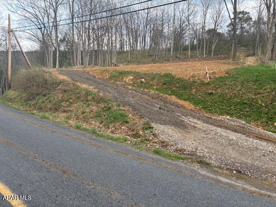 Discover the perfect slice of nature with this 1.88-acre vacant lot, offering endless possibilities for your dream retreat or future home site. This property provides
privacy, tranquility, and a connection to the outdoors.  Located just minutes from 961-acre Canoe Creek State Park centered around a 155-acre lake and directly across from excellent fishing in Canoe Creek, this lot is a haven for outdoor enthusiasts. Whether you enjoy casting a line, setting up camp under the stars, or simply unwinding in nature, this property delivers.  With no utilities currently in place, you have the flexibility to design and develop the land to suit your vision--whether it's a residential build, a seasonal getaway, or a rustic camping spot. The surrounding area is rich with opportunities for hiking, biking, and exploring, making it a prime location for anyone who loves an active, outdoor lifestyle.  This is your chance to own a piece of the outdoors.  Lot is still approximately 50% wooded.