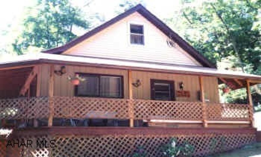 7.655 ACRES NEAR STATE GAME LANDS.  ONLY 6.5 MILES FROM RAYSTOWN LAKE.  VERY PRIVATE COVERED WRAP AROUND PORCH.