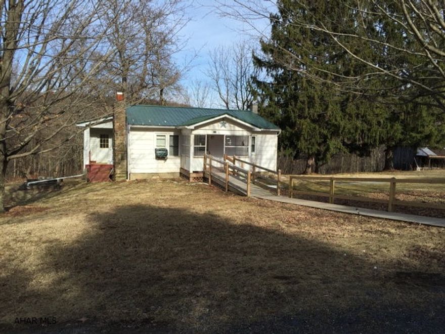 Great property for that small family starting out, or that second home get-a-way. Would even make a great camp for hunting enthusiasts. Two bedroom ranch nestled quietly on 8 wooded acres. Water is supplied by a cistern with a pump. Contents in barn convey.