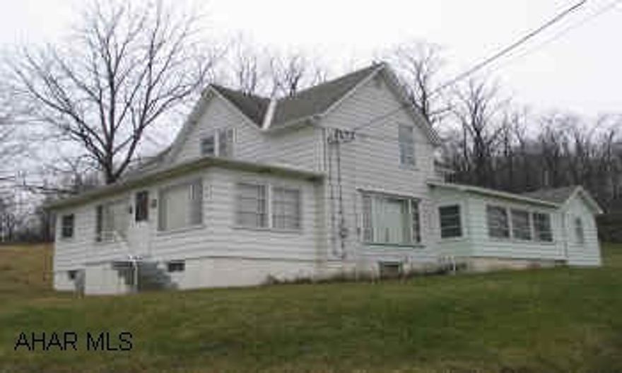 Two-story country home with acerage and barn. Home Warranty included.