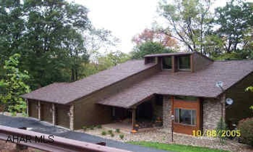 Brick and cedar contemporary loaded with features. finished basement adds 2346 of living space. Hardwood and ceramic tile flooring, pantry, walk-in closets, 2 decks 2 fireplaces 3 car garage,paved driveway,2 oil furnaces, 2 heatpumps, 2 hot water heaters. Well kept home close to town.