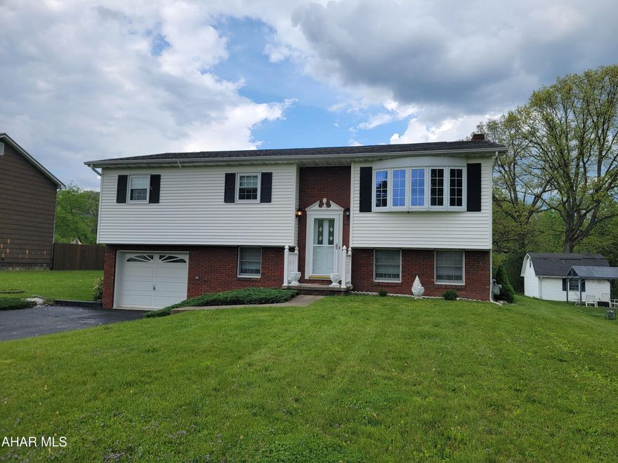 Very well maintained 3 bedroom bi-level with finished basement. Sunroom off dining area. Gas fireplace in living room. Finished basement includes a family room, den, bath and a laundry/utility room. 1 car integral garage. Two tier deck. Close to the Tyrone School District Campus. Ready to move in !!!