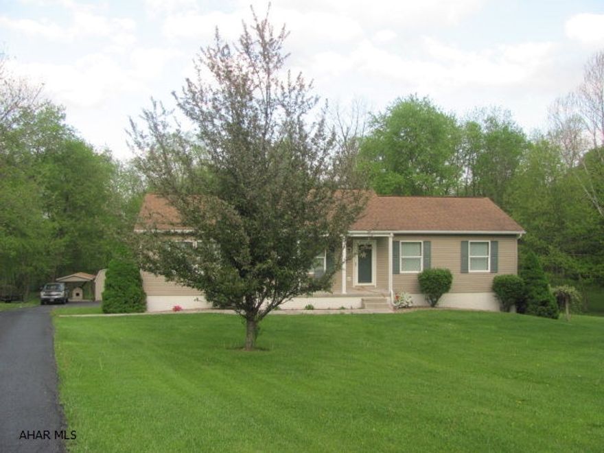 This charming Ranch Style home is nestled into the country side on 2.85 acres, just minutes from the community of Roaring Spring. This home is in excellent condition and has nice big yard area surrounded by fertile farmland and hunting areas. The property offers three nice size bedrooms and two full baths. The basement area has a large family room that could be used for additional bed room, exercise room, office area or a recreational room. This family room has an oversize walk-in closet lined with cedar. The property is well maintained, and includes an above ground pool, 12x20 shed and  covered dog kennel area.