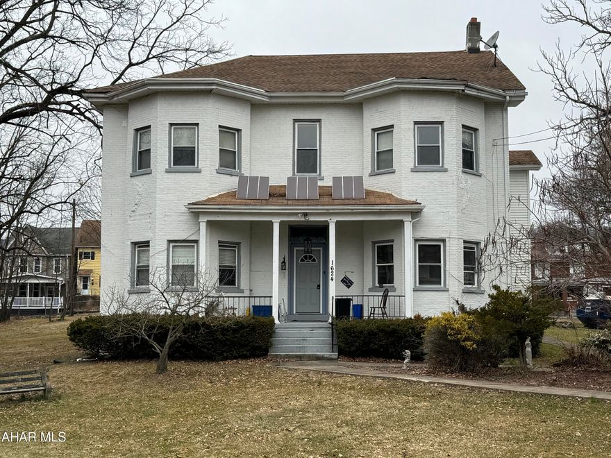 Welcome to this charming brick home built in 1850! This home has endless possibilities. Keep as a family home, live on one side and rent out the other 2 (could be 3 units) or use it for an investment! The .88 acre of ground is fully fenced. There are basically 2 kitchens and baths on the first floor.  There is 1 kitchen and 2 baths on the second. The home has new flooring and new wall units. Definitely lots of space here! Call listing agent to tour!