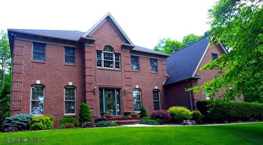 This all brick 2 story home is situated on 1+A with a private, wooded setting in Sylvan East. Spacious kitchen with new granite counter tops with cook top,double ovens & a breakfast bar. Off the kitchen is a sunken Family rm w/fireplace, 24ft. cathedral ceiling, recessed lighting & h/w floors. Formal Dining rm, Living rm & Den. Second floor has 3 bedrooms & a loft. All  three bathrooms have been beautifully renovated. solid wood front & back staircases. Finished lower level with tile floor & wet bar. Screened-in sun room leads to the patio & a gorgeous in ground heated pool, all have concrete epoxy sealed surfaces. New roof 2016, 4 zone hot water & central air. Quality craftsmanship from top to bottom & meticulously maintained.  Don't  wait on this VERY SPECIAL HOME!!
