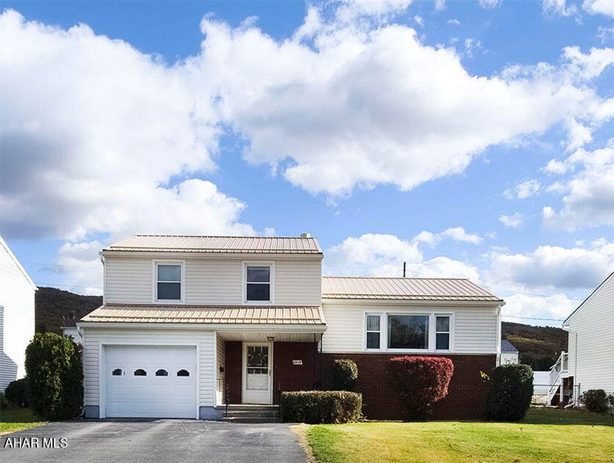 Welcome to 1215 Madison Avenue in Altoona!  This well-maintained 3-bedroom, 1.5-bath multi-level home offers a comfortable and functional layout with plenty of natural light throughout. The main level features a bright and spacious living room with a large picture window, an inviting dining area, and a practical kitchen that's ideal for everyday living. Upstairs, you'll find three nicely sized bedrooms and a full bath. The lower level provides additional living space perfect for a family room, home office, or play area, along with a convenient half bath and laundry area. The exterior includes a one-car attached garage, paved driveway, and a well-kept yard with room for outdoor entertaining or gardening. Conveniently located near shopping, restaurants, and schools, this home offers suburban comfort with easy access to all that Altoona has to offer