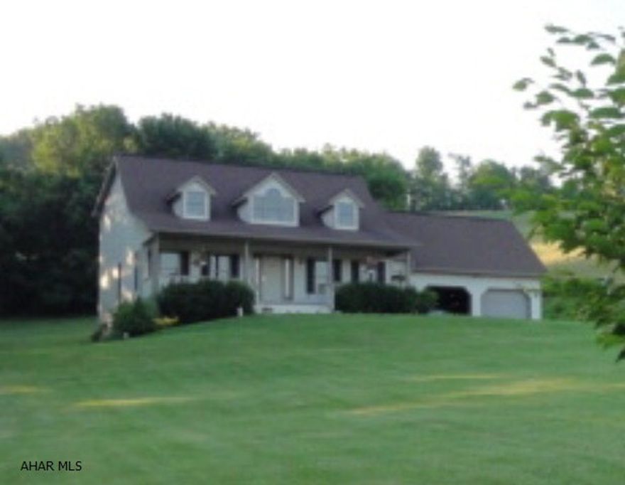 Sitting on almost 2 acres of ground is your well-cared for home, move-in ready and offering spectacular views in a country setting.  This is your opportunity to enjoy a quality built house done with beautiful craftsmanship that is great for guest entertaining.  This house has it all - and is much larger than it looks.  From the moment you enter the doorway the soaring vaulted ceiling opens up this lovely spacious home.  The kitchen area includes a large breakfast/sitting area and overlooks a 28'by 12' deck with hilltop views.  Built in 1999, this house has 2200 square feet and was custom-built with 2x12 floor joists and 2x6 framing.  It includes 3-4 bedrooms, depending on their use, with walk-in closets, 2 1/2 baths, a 1st floor master, lots of storage space, and an attached 2-car garage.