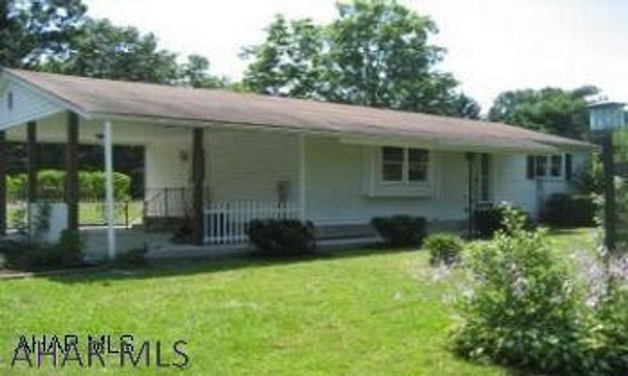 Logan Twp./Greenwood 2 BR, 1 BA Ranch on a level lot with a covered patio that could be used as a carport. Nice lot with an area behind it that was formerly used as a mobile/motor home hookup. Area shopping and restaurants. Unfinished partial basement great for storage. well water. Propane space heater in basement also - could heat the home.  Basement stays dry, but if the power would be turned off to the sump-pump a slow accumulation could happen.  Prior owner/tenant stored everything there with no problem for years. Not in a Flood Zone, but a flat area.  Nice area!!  Seller is a licensed Realtor.