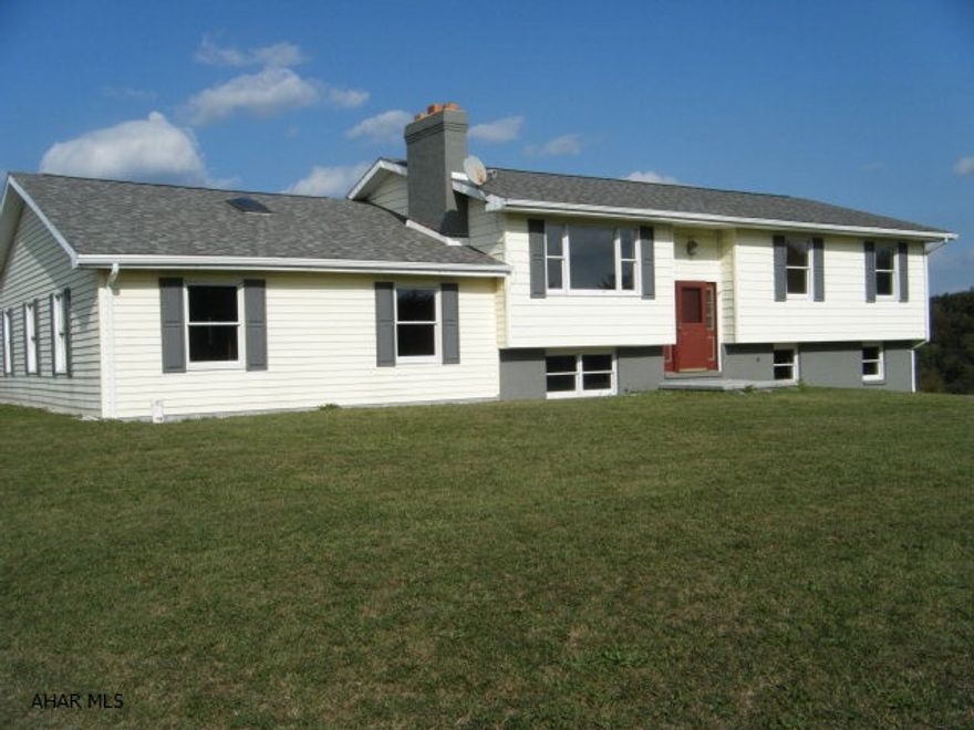 Nice condition repo. Lots of level yard space, country setting. Original bilevel home 28x44 with family room addition 24x40 with cathedral ceiling. Blacktop driveway and parking area. Roof 8 yrs, furnace 6 yrs with floor radiant heat in bilevel main floor, remodeling throughout. Rooms in basement for more finishing. 4 garage spaces. Rear patio with roof over 1/2.