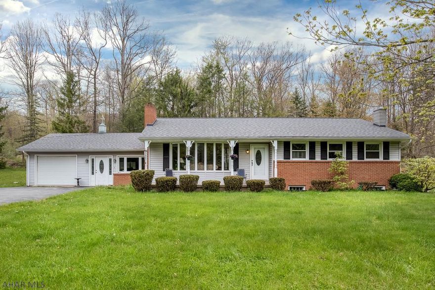 Wooded scenery...this home is for you.  1 story home with 3.66 acres, 3 bedrooms, 1.5 baths, basement just completed with family room - wood burner, nicely done.  1/2 bath off family room, in basement additional storage.  Fireplace in Living room 1st floor, eating area in kitchen, additional dining room in family room on first floor, sun room with wooded view.  Call for your showing!
