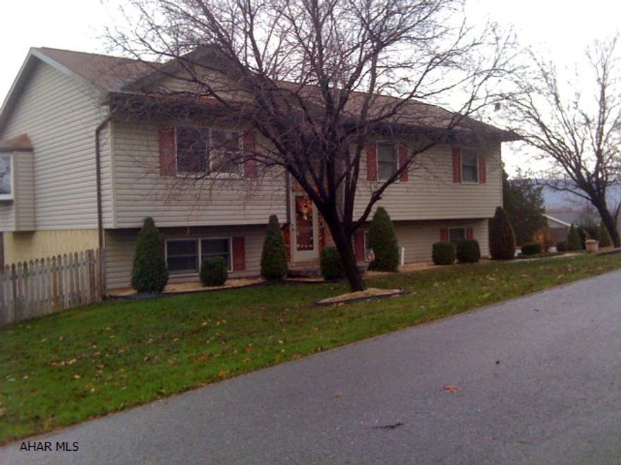 Beautiful split entry home situated on 2 lots. Great neighborhood. Inside of home is gorgeous! New hardwood w/ inlay flooring & tiled kitchen/ hall. Steps hardwood (lower set to be completed by closing. home built in 1993.