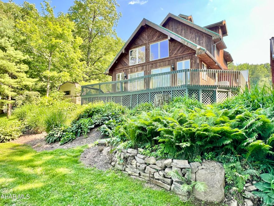 One-of-a-kind home overlooking the Juniata River. If you have been looking for a getaway or full-time residence with river frontage, then look no further. This home offers 3 Bedrooms, 3 Baths, beautiful custom kitchen with granite counter tops, large windows and patio doors overlooking the river, screened-in porch, deck, and much more. The detached garage has a finished studio above and would make great boat storage. Located not far from Raystown Lake and State Game Lands.