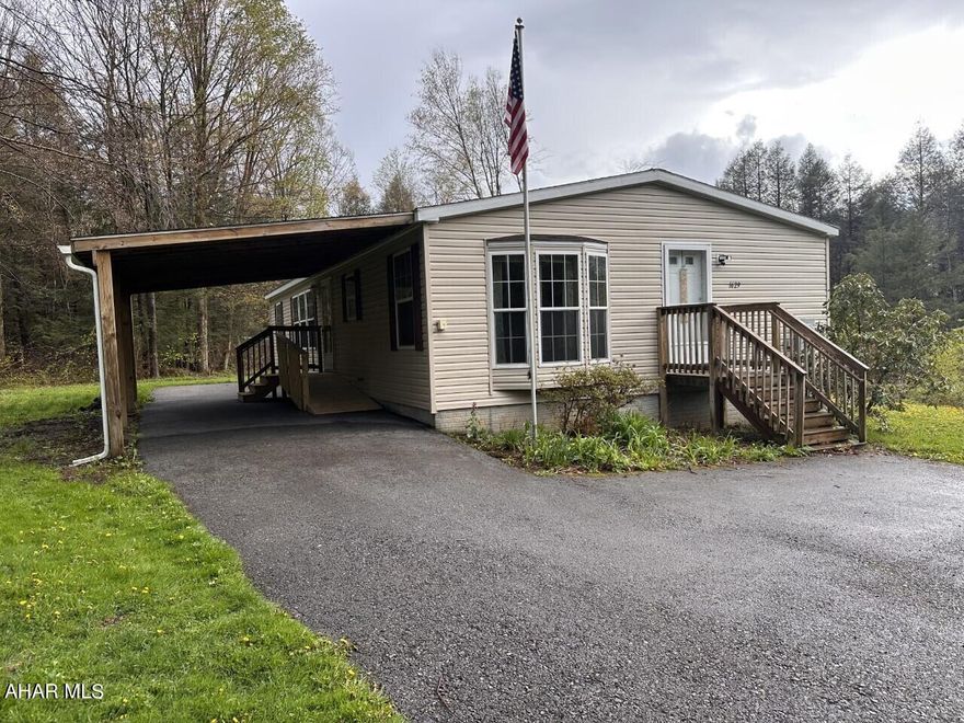 Central Cambria schools- Jackson Twp 3BR, 2 bath 2007 vinyl sided doublewide on approx 1 acre oil FA heat, Carport- paved patio area. All appliances included.