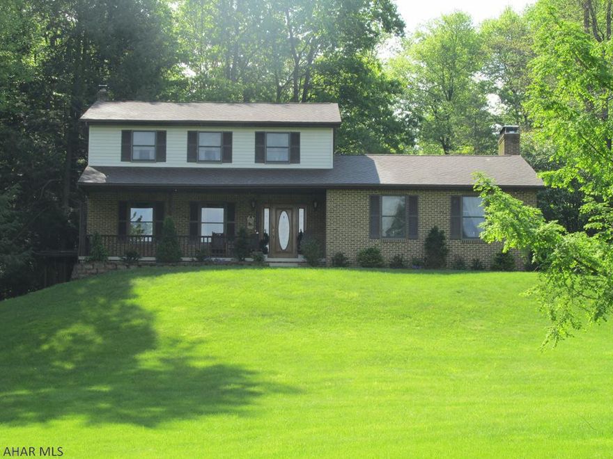 Come experience the peace and serenity one feels while relaxing on this home's covered deck with lovely views of the gardens, koi pond, & wild life.  Simply stated elegance is enhanced by the many charming features (Crown Mold, cedar closet, whirlpool tub) over 2800 SqFt all on 3.14AC.  Conveniently located midway between Altoona and State College.  LR, DR, 1/2BA, FR with wood burning FP, 4 BR, 3 Full BA.  **Completely finished lower level with walk out, FR, BR, Full BA, Laundry and plenty of storage and pantry.  Two car attached garage + 2 car detached garage.  This pristine property is just beautiful!  Don't wait on this one!!