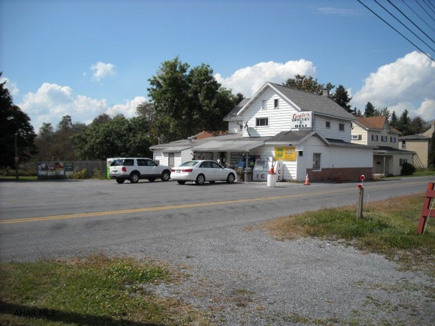 Former Carole's Grocery store in Tunnelhill. Has an attached house & two 2 car garages on about 1+ acre of ground. Residents want it opened.  Patrons stop daily.  Investors have an exclusive market with local patrons, hunters, etc.  Possible short sale. As-Is condition. Beautiful views out the back. Tunnelhill train tunnels below these parcels. Deed book 2202/214.  *Price change was required by bank - offers? Store: 3 Coolers (one Deli), Slicer, Register, & Scale.  Allegheny Twp.