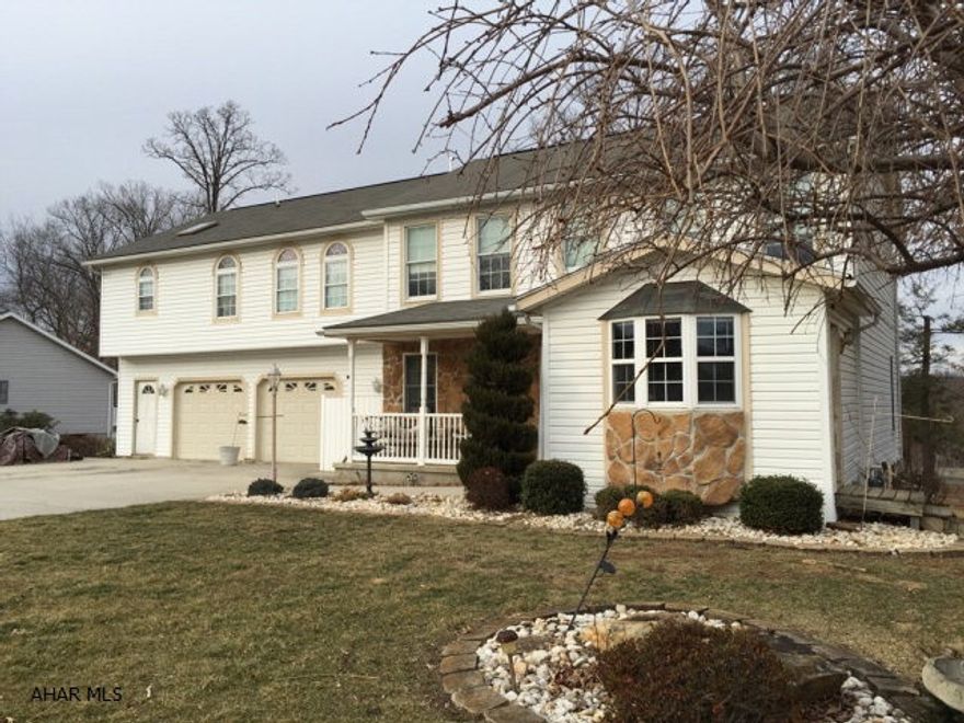 Large two story home with a fabulous back yard. A custom made kitchen is at the heart of this home. It easily accommodates two cooks with two distinct work areas that open onto a terrific back deck, pool and extra large yard. A family room, dining area and another living room now used as a large home office)complete the first floor. The second floor has a huge master wing complete with den, master bedroom, walk in closet, bathroom and laundry room. An additional 4 bedrooms and an additional bathroom are found on the second floor.  The lower level has a home theatre room,  bath and walk-out to backyard.