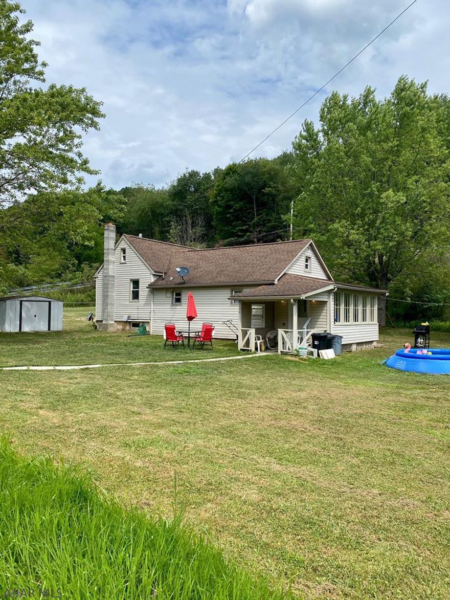 Off the beaten path on almost 1/2 an acre sits this adorable ranch home just waiting for you to call it HOME. Featuring 2 spacious bedrooms with their own closets, a kitchen with all the cabinets and counter space you need, a little dining area right off the kitchen, nicely updated bathroom, a big living room, and an enclosed porch! Off street parking and a nice flat yard outside. Solid bones and updated mechanics too. WILL QUALIFY FOR $0 DOWN PAYMENT USDA FINANCING.
