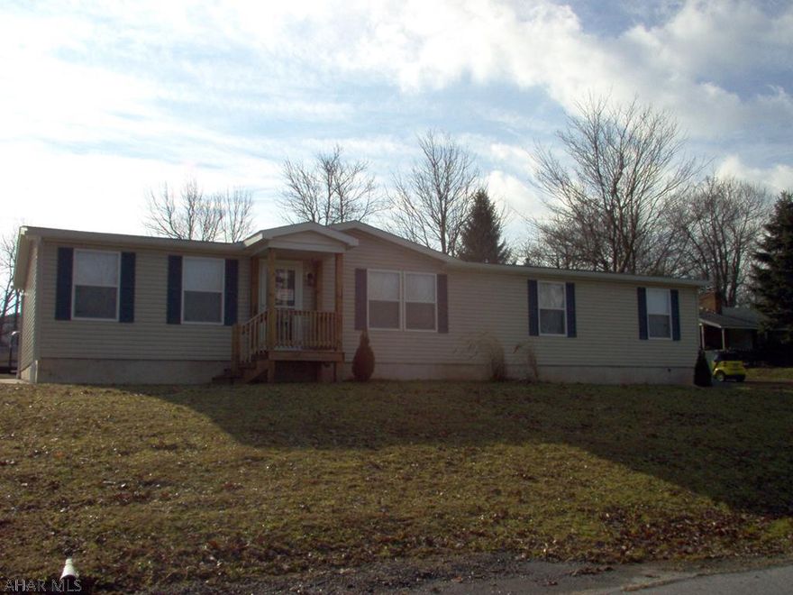 Double lot in Broad Top, with a newer home on a full foundation. Close to Raystown and State Game Lands.  Nice retirement home or vacation property. Property is part of an estate, and must be sold AS-IS;WHERE-IS. There is a derelict trailer, which should be scraped and removed, must be done at Buyer's expense.  However, there is a second set of water and sewer hook-ups which could provide an auxiliary trailer pad.
