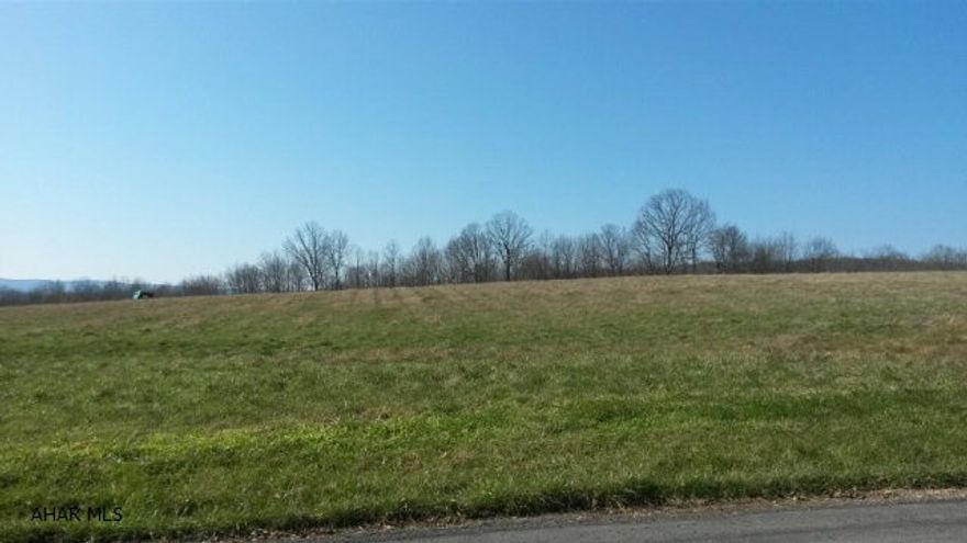 Very nice building lot consisting of almost 12 acres off of a quiet country road in Osterburg. Lot is cleared and has public water and sewer taps on the property. Electric poles also on property. Over 400' of road frontage for access. Lovely views ready to be enjoyed from your dream home. Up to 25 taps for water.