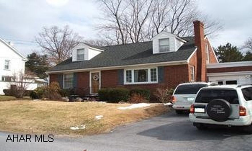 All Brick Home with attached garage - Centrally located, 3 Bedrooms, Large Living Room with fireplace, Hardwood floors, Dining Room with built-ins, Counter space in Cheery kitchen, Laundry shoot in hall closet, pocket doors in kitchen, enclosed breezeway, walk out basement, loads of closet space, large yard, central air, 2 bathrooms.  Take a look at pictures!