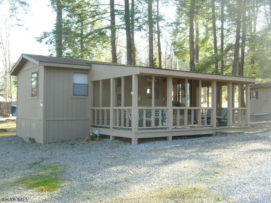 Camping in this unit is anything but roughing it.  Immaculate remodeled park model is spacious and full of light.  Set on a double lot with two sheds there is plenty of room for parking.  The park model has a wide - soon to be screened in - deck with furniture so you can enjoy the outdoors rain or shine / day or night.  Inside you will find tile floors throughout.  Sit in the living room area in the day and open the day bed / trundle for extra sleeping at night.  Bedroom has a double bed so there is room for the whole family.  This property comes fully equipped with furniture, pots, pans, dishes, linens, two sheds with tools, a gas grill, air compressor, lawn mower and weed eater.  Firewood is ready for a campfire in your fire ring.  Both sheds have electricity and new roofs. A/C Unit