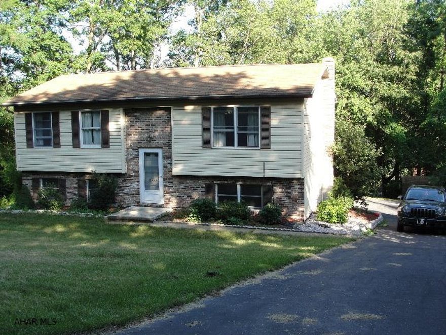 Live in the Highlands in a great neighborhood!Close to Juniata and area schools.Quiet area with feeling of privacy. 4/5 bedroom bi-level home, carpeting, separate heating downstairs. Large eat-in kitchen, 15 x 15 deck off of kitchen-great for entertaining or relaxing. 2 bedrooms and bath upstairs with deep hall closet. 2/3 bedrooms and bath downstairs, large storage area under stairs, laundry area with plenty of room and door to outside patio.  Nice size yard around house and paved driveway with spacious parking/turn around area under deck.Closets in each bedroom and plenty of storage throughout.
