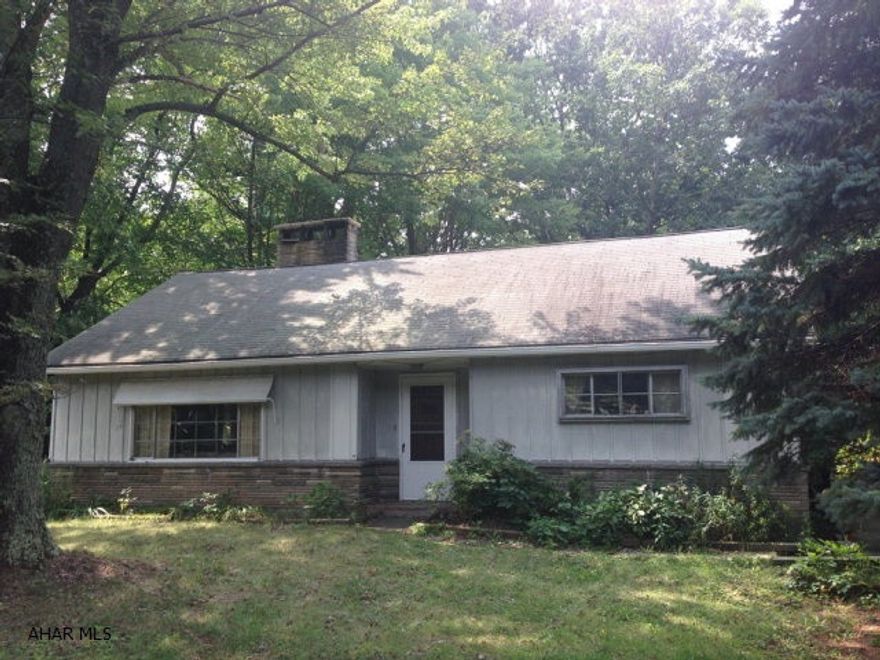 Quaint 4 BR, 1.5 BA house on a private lot with garage. With some TLC this could be a sweet home.