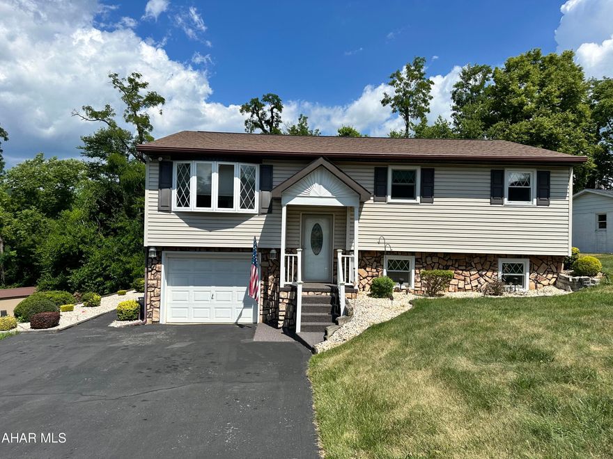 Lovingly maintained 3 bedroom, 2 bathroom split entry home in Rolling Hills Subdivision. This home is in the Hollidaysburg School District and Frankstown Elementary. The main floor boasts a formal living room with bay window, white kitchen cabinetry and a dining area that accesses the sunroom. The lower level offers a rec room with fireplace, 3/4 bath and laundry, there is also access to the garage. Buyer is responsible for any lender required repairs. Carpet to be professionally cleaned.