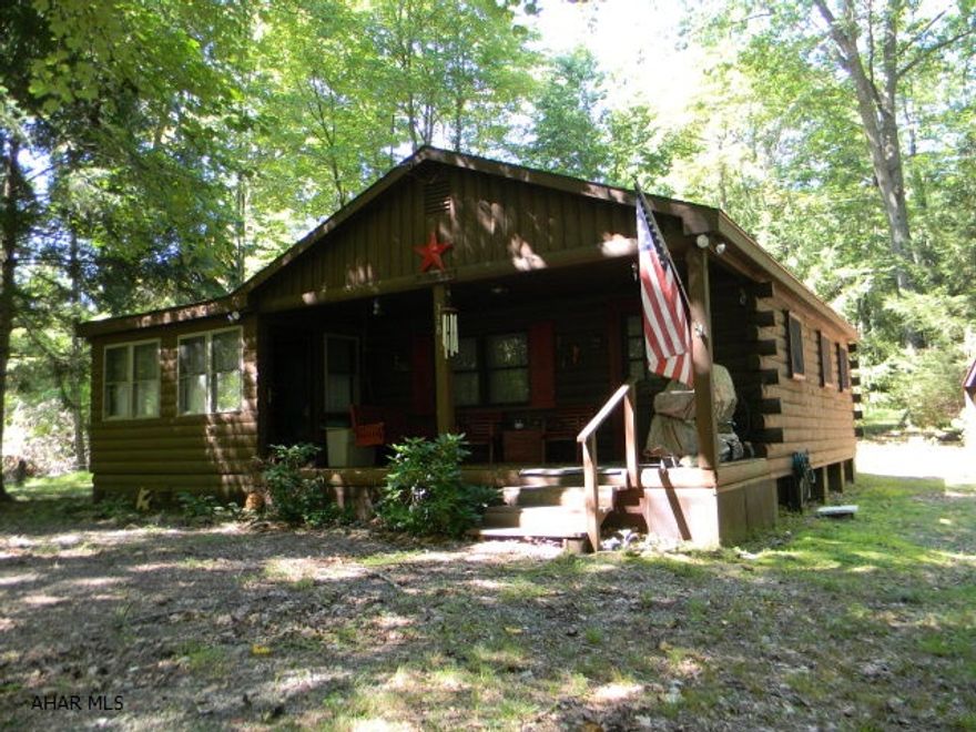 If you are looking for the perfect getaway in the mountains of central PA, this is it! Close to James Buchanan State Forest and pike to bike trails. Close to I-70 and the PA Turnpike. This property is located in Valley-Hi, huge lake and 500 acres adjacent to the lake that are privately owned. Valley Hi is not a Homeowners Association, buyer becomes a member and has a membership in Valley Hi Development Association, Inc. This Northern Pine log home is situated on a wooded lot with hunting and hiking just out the back door. Very well maintained with 3-bedrooms, 1-Full bath, LR w/cath. ceiling, dining area and kitchen. Pine board walls throughout, enclosed porch, covered porch and large shed. Super relaxing property.