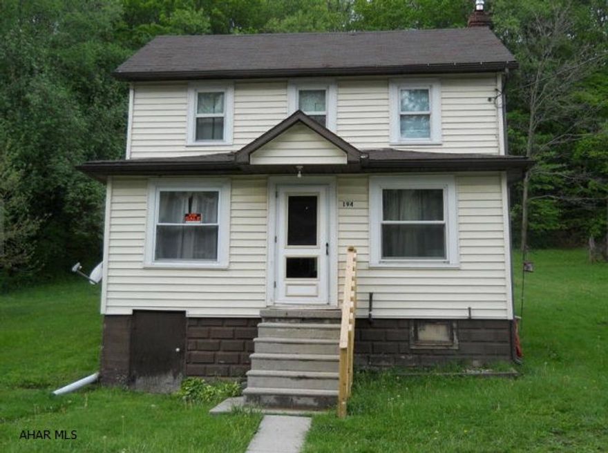 Cute 3 BR (1 captive)starter home on 1 acre. Large 2 car detached garage on gravel road