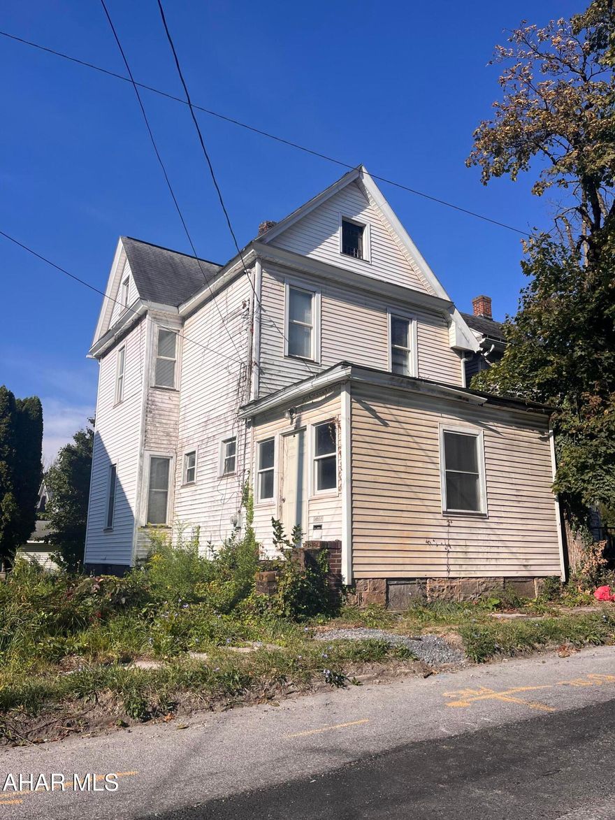 This is a fixer upper that offers 1.5 Baths a full walk up attic updated electric service and all new windows in 2000 and large updated EI kitchen.
double lot and garage complete this potential for a great home or investment property.