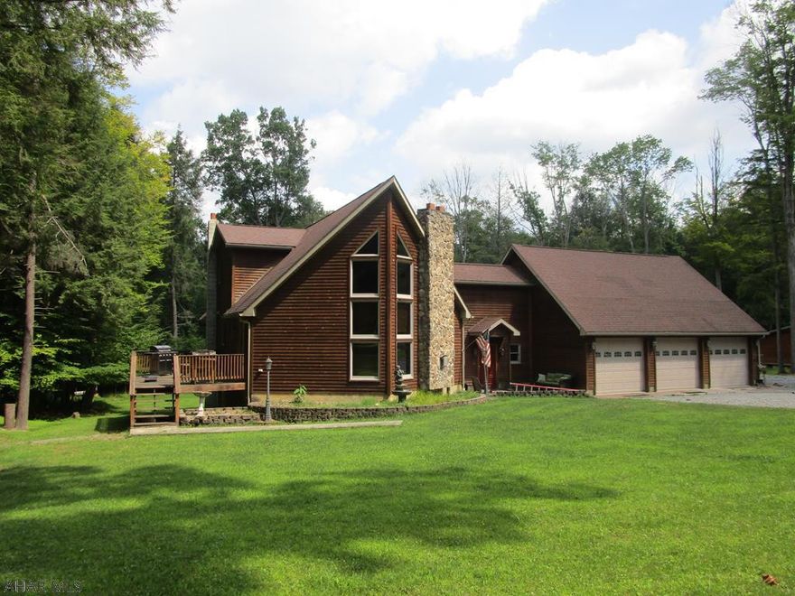 Unique modified a frame on a 1.49 acre lot. This home boasts a large living room with cathedral ceiling, oak kitchen, laundry room, oak foyer, large family room and first floor bedroom and bath. Second floor has 2 bedrooms and a full bath. Nice rear yard and rear and side deck. Three car attached garage with drywall interior. Full unfinished basement, newer furnace.   Amenities of Glendale Yearound available to this property (pool, tennis etc) Great home for the $$.