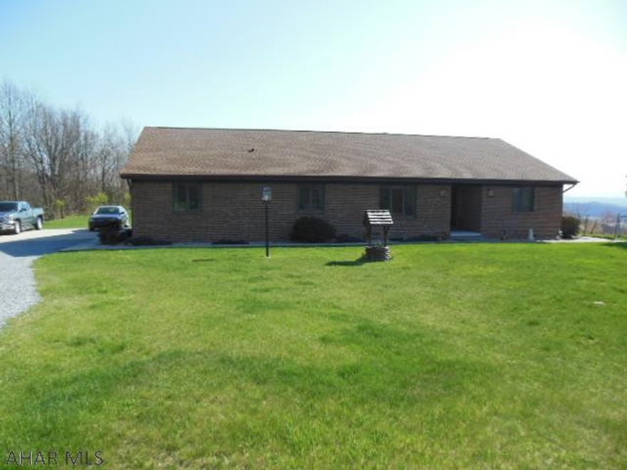 Beautiful All Brick 3 BR, 2.5 BA Ranch Home on 11.67 avres with appliances and views "to die for"!   Two car garage with auto-opener, In-ground pool with some accessories like a lounging canopy, sun room with wood stove that takes advantage of the views for 20+ miles. Ceramic Tile flooring, and a large basement for storage.  Has a heat pump for heat and A/C and wood stove in basement to enhance the heating comfort, or if the power would go on the blink.  Economical heating in first class living for this superior built comfortable home that has an Oak kitchen, tile floors, first-floor laundry and more! Unique, Private living!  (fireplaces indicated are both wood stoves)