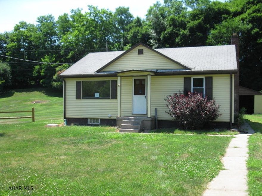 Handyman or Investor - Cute 2 bed on large level lot in nice rural area.  Large eat in kitchen has newer cabinets. Some hardwood floors and tile, newer bath. Needs some finish work and TLC.  Flood insurance required.  Centrally located between Altoona, State College and Huntingdon.  Subject to short sale bank approval. Being sold As Is.