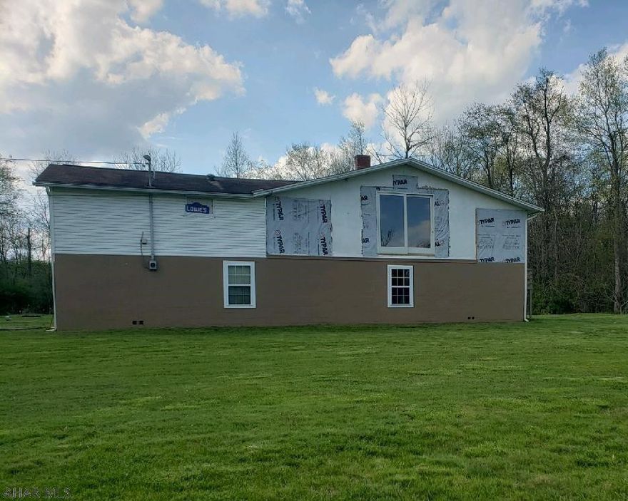 Raised ranch on .59 acres. Bring your imagination!!!! This house was completely gutted. Framed walls in place.Open concept kitchen and living area. Bedroom and bathroom on one side. Master suite on the other. New 200 amp electrical breaker box installed. Come make this home your own. Perfect for a Reno Loan!