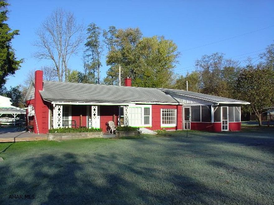 (GPS Shows address as Huntingdon).  Actual address is 3548 Shangri La Lane, Mill Creek, PA 17060.  Beautiful setting.  River view from your screened sunporch, deck, and covered porch.  Eat-in kitchen, dining area, spacious living room with pellet stove (+oil heat), 1 bedroom, 1 bathroom.  2-bay boat/carport + storage building.  Great get away place or yearound home.  Good fishing on the Juniata River!  J-183