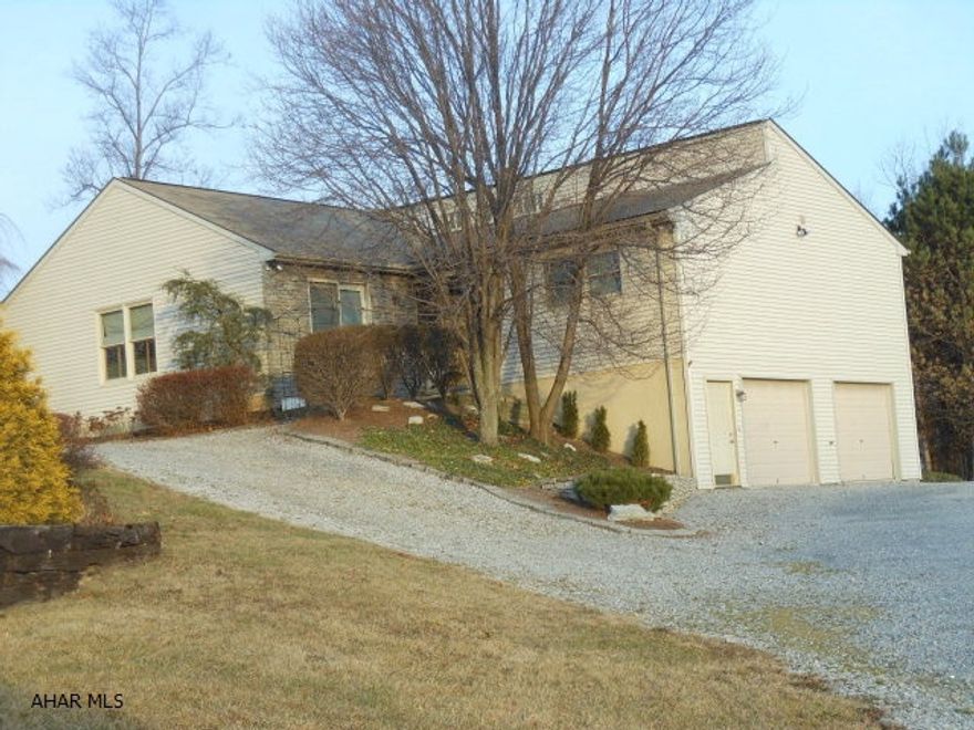 Lovely Ranch home situated on 1.5 acres. Great open floor plan w/eat-in kitchen and family room and fireplace. Cathedral ceilings, heated and cooled Sunroom with lots of natural light. Private master bedroom and bath. Rec Room on lower level and garage large enough for 4 cars! Move in ready, side patio and pergola.