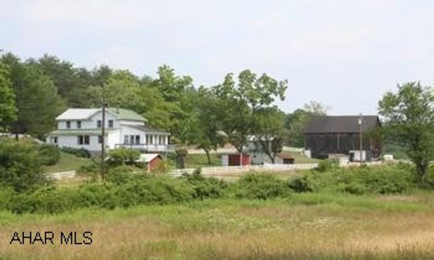 197.22 Acre Farm w/2-story vinyl 3BR/1BA house, located in scenic countryside of southern Bedford County. 197.22 Acre Farm w/2-story vinyl 3BR/1BA house; LR, DR, kitchen, enclosed sun room.  Located in scenic countryside of southern Bedford County.  Acreage includes approx 30 acres open fields, 165 acres wooded, and approx 8 acres partially fenced. 2 acre stocked spring fed pond is 6-12' deep.  Outbuildings include:  40'x42' barn, 17'x19' detached garage, 8'x12' garden shed, 12'x15' maintenance shop, 12'x21' storage shed and corn crib.  Stream on property.  Relax and enjoy the beautiful countryside and mountains.