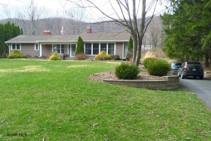 Bright and spacious 3 bedrooms, 1.5 bathroom ranch home on 1/2 acre lot. Renovated kitchen includes newer cabinets, flooring, faucet and granite countertops. Walkouts from both living room and kitchen open onto large decks with incredible views. The living room has large windows that bring in tons of natural light. Newer roof, furnace, siding, windows, doors, flooring, kitchen add to the appeal. Over sized two car garage on a gorgeous professionally landscaped yard. Gorgeous inside and out!